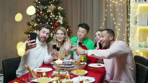 Friends Celebrate Christmas Together with Holiday Cheer
