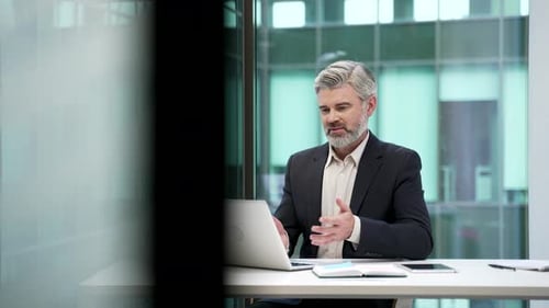 Business Man Talking During Video Conference in Office