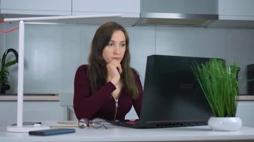Skilled Business Woman Typing and Scrolling on Laptop Keyboard at Home Office Desk
