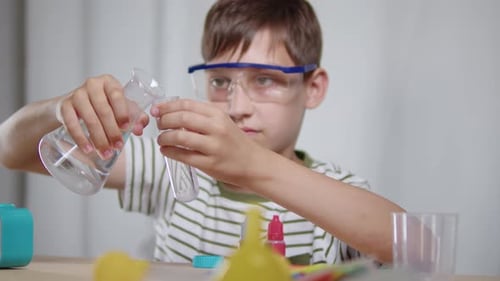 Boy Conducting Science Experiment at School Desk