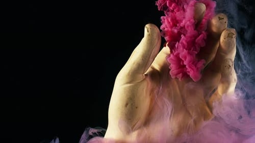 An Abstract Hand with Colorful Smoke on a Black Background Showcasing a Vibrant Aesthetic