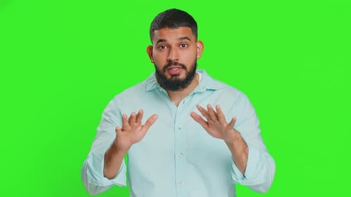 Young Adult with Beard Pushing Hands Forward