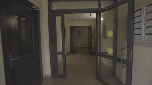 Entrance Hall with Transparent Doors in Residential Building