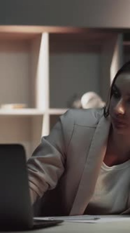 Woman Finishes Work, Closes Laptop and Stretches