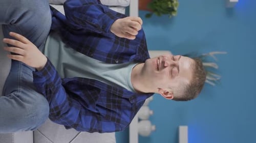 Vertical video of Positive man happy and smiling.
