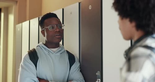 Conversation, talking and students or friends in college campus for scholarship learning