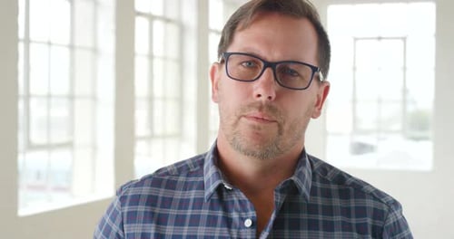Man With Glasses Looking Into Camera