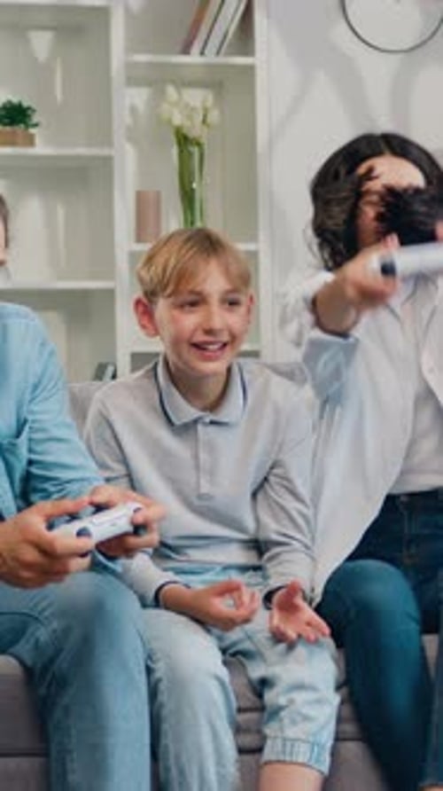 Family playing video games in the living room