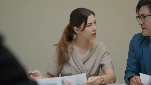 Team Discussing Project in Corporate Setting