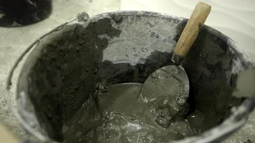 Close Up of Mortar and Trowel in Bucket