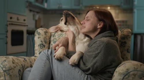 Woman Hugging Dog at Home