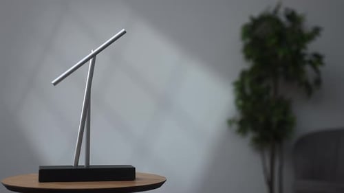 Minimalist Magnetic Pendulum Balancing on Wooden Table