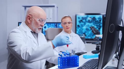 Scientists Working with Test Tubes in a Modern Lab