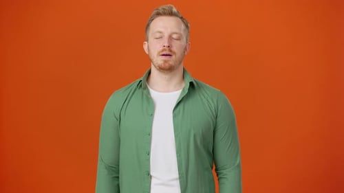 Nervous Man with Beard Tries to Restore Normal Breathing