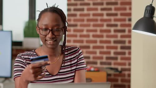 Young Adult Shopping Online with Credit Card