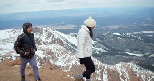 Couple Taking Photos at Top of Snowy Mountains, View From Peak Adventure