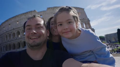 Family Posing in Front of Colosseum, Rome
