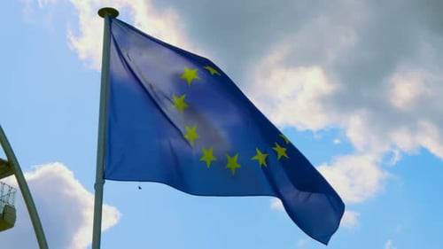 European Union Flag Waving Against Blue Sky