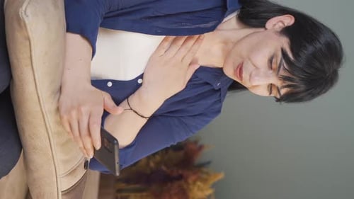 Vertical video of The woman in love gets excited at the incoming phone message.