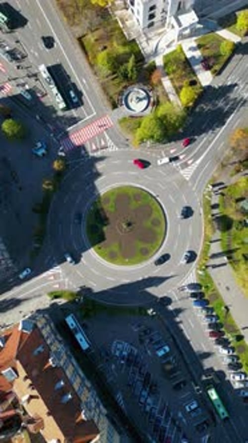 4K aerial perspective of city center of Brasov, Romania. Camera in tilt down position on main boulev