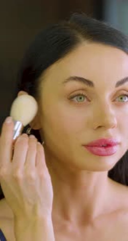Woman Applies Makeup with Brush, Beauty Portrait