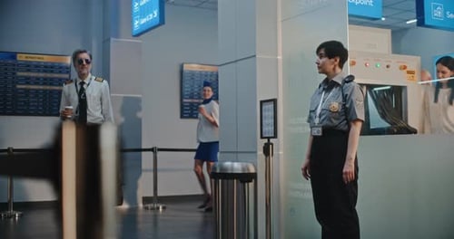 Airport Terminal Airline Pilot and Two Flight Attendants Walking for Boarding Plane Flight