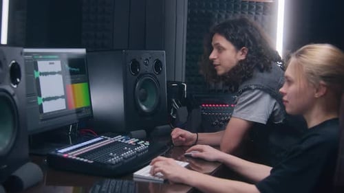 Music Production Team Working in Sound Studio