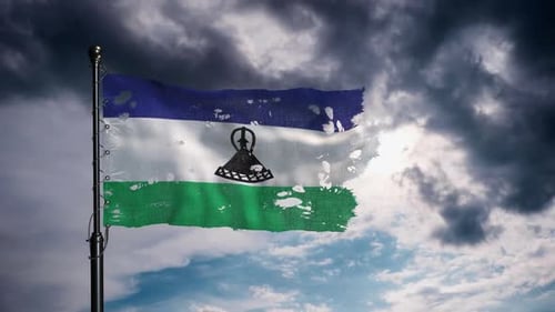 Lesotho National Flag In Motion Under Thundercloud Filled Sky