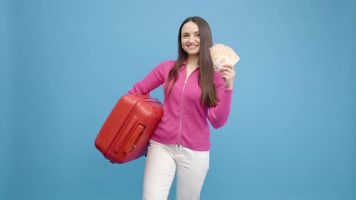 Happy Woman Holding Suitcase and Money