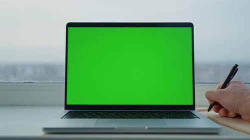Laptop with Green Screen for Compositing at Desk