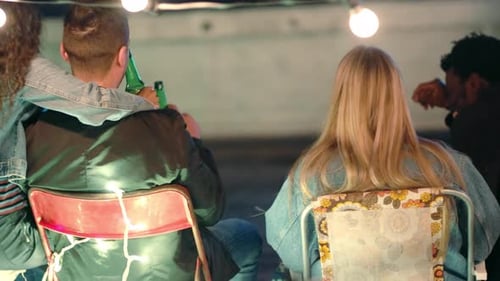 Young Adults Enjoying an Outdoor Party at Night