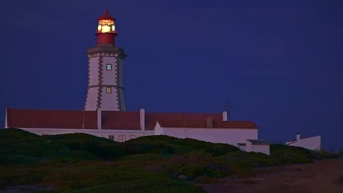 Lighthouse Sending Its Light Beam at Night Cape Espichel Portugal