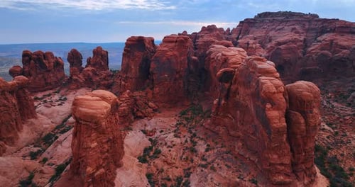 Red columns and walls of rocks with rounded tops. Amazing scenery of the Arches National Park
