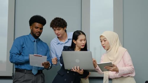Diverse Team Discussing Work in the Office