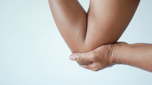 Young Man Suffering Pain on Elbow