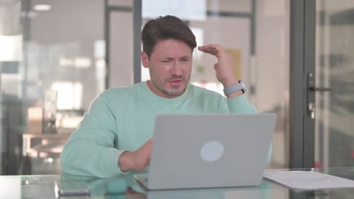 Depressed Man having Headache at Work, Migraine