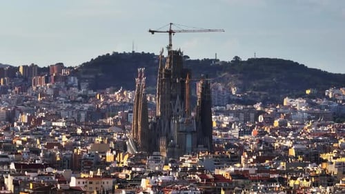 Circular Footage of Sagrada Familia at Golden Hour Aerial Zoomed View of Famous Tourist Landmark