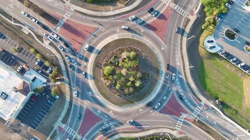 Traffic Circle on American Road with Driving Cars Overhead View of US Roundabout Intersection