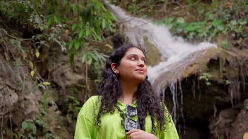 Indian Woman Looking at Waterfall