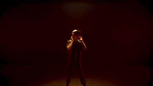 Young woman using VR headset in colorful lighting