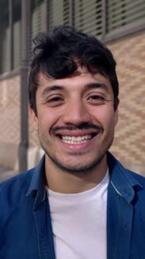 Young Man Smiling in an Urban Environment