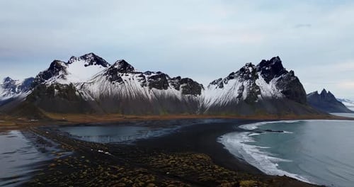 Snow-Covered Vestrahorn And Black Sand Beach