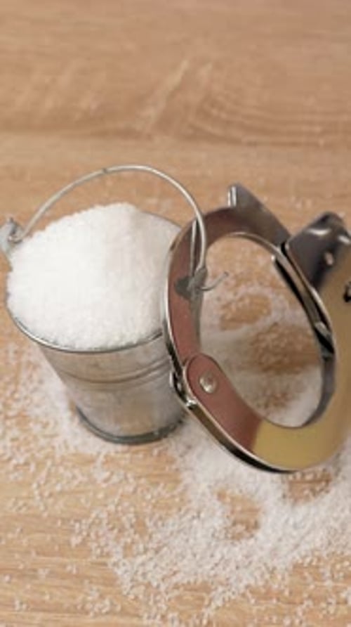 24v. The man is handcuffed to a metal bucket with salt. Abuse of salt.