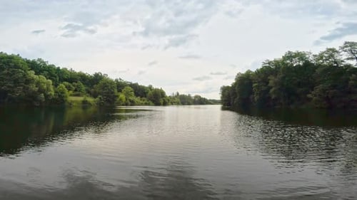 Summer River with Bright Blue Sky and Clouds