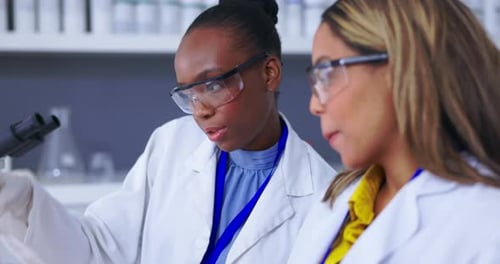 Scientists Examine Blood Sample in Laboratory