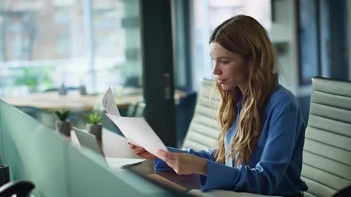 Successful Woman Reading Documents at Office Desk Closeup Professional Manager