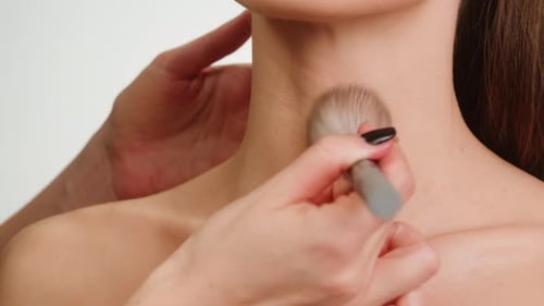 Beauty Shot of Woman Makeup Artist Applying Foundation Bb Cream on Previously Applied Moisturizing