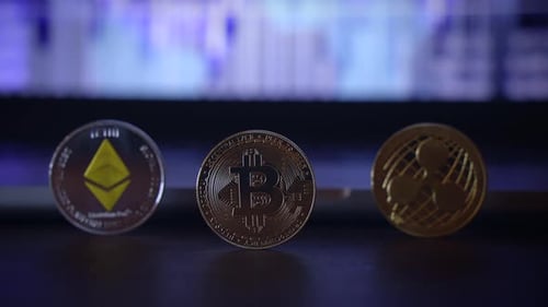 Cryptocurrency Coins in Front of Stock Market Graph