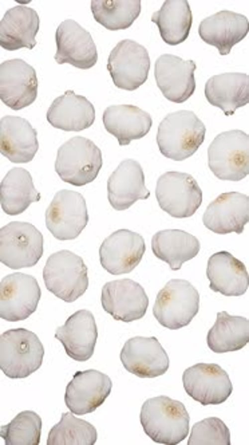Vertical Falling Garlic on White
