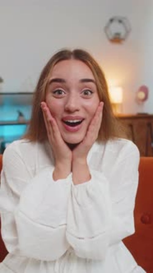 Woman Reacts with Surprise and Joy